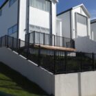 image of slanted black metal balustrade fencing at a residential property in New Zealand, designed and installed by Axiom Fencing, Balustrades & Gates