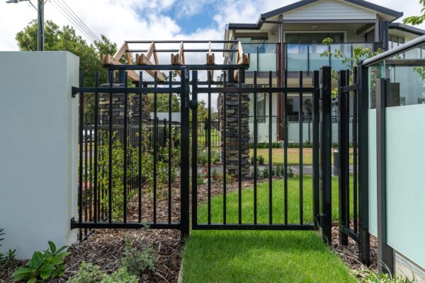 image of black metal security gate installed at Oceania Bellevue healthcare facility in Redwood designed, and installed by Axiom Built