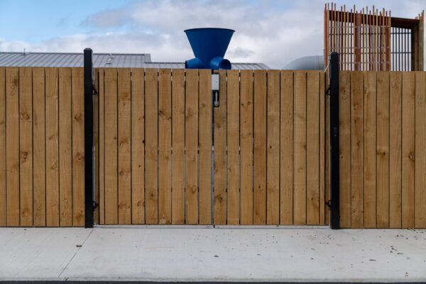 custom wooden and metal security gate installed by Axiom Built at Pītau-Allenvale School in Belfast, Christchurch