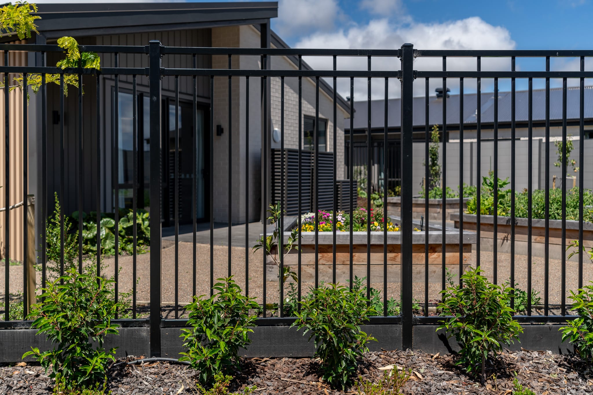 Black steel fencing for Bupa Retirement Village in Prebbleton NZ, designed, manufactured and installed by Axiom